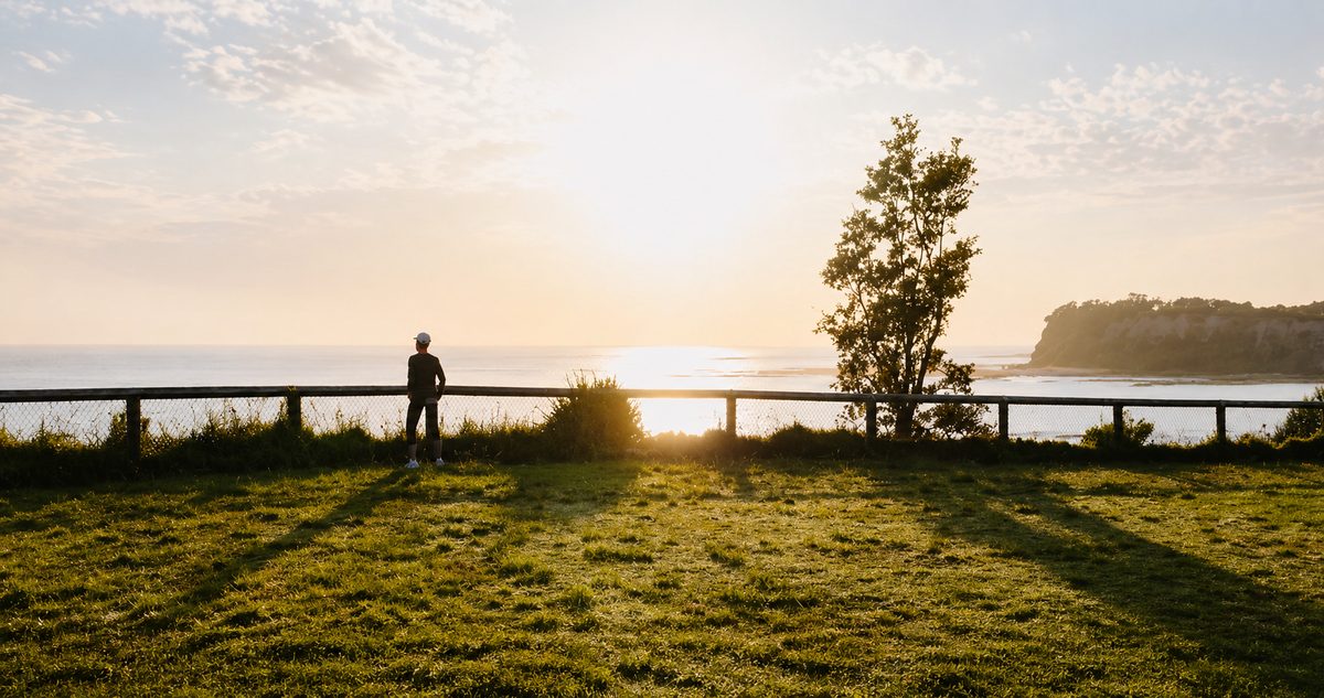 Person overlooking the water at sunset near Fairhope, Alabama